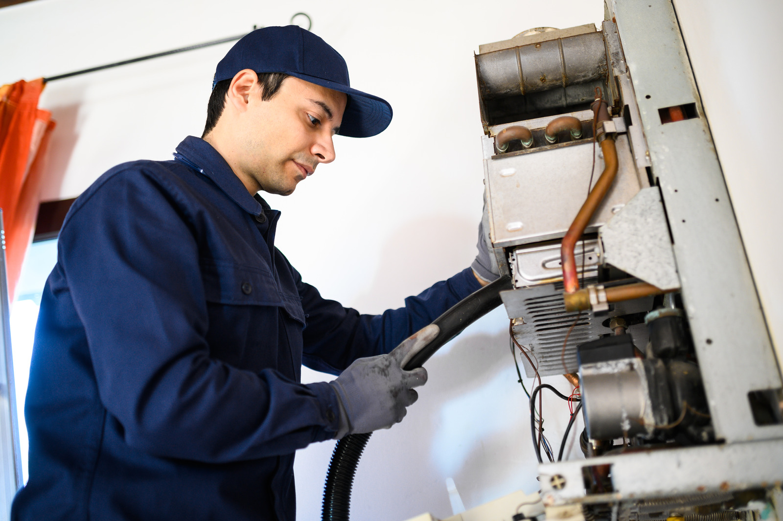 technician repairing Hot water heater in Surrey