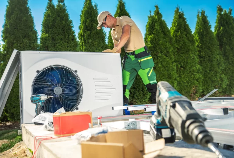 HVAC technician repairing heat pump