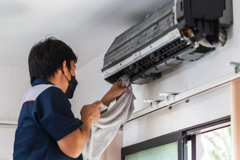 repair man fixing ac repair in Surrey