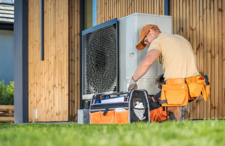 HVAC technician repairing a heat pump in Surrey