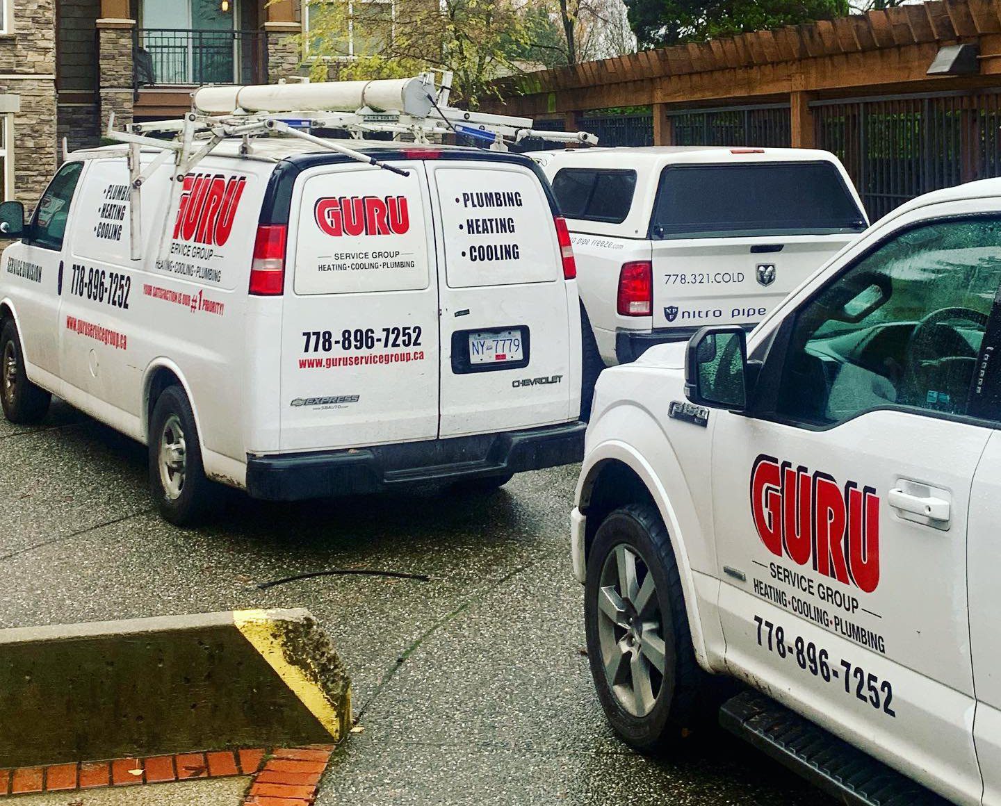 Guru Service Group vans ready for plumbing, heating, and cooling services in Surrey