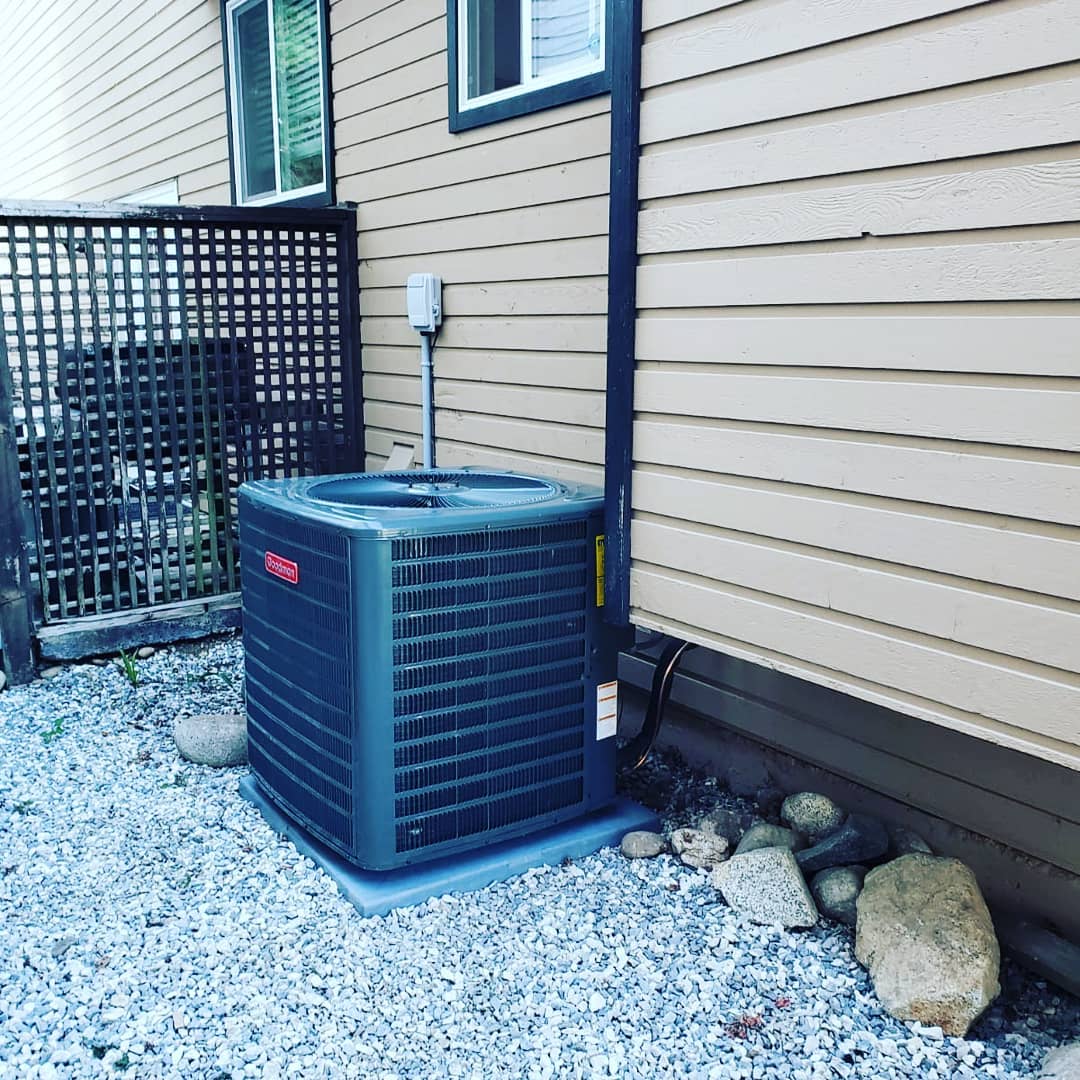 Surrey HVAC technician installing energy-efficient air conditioner