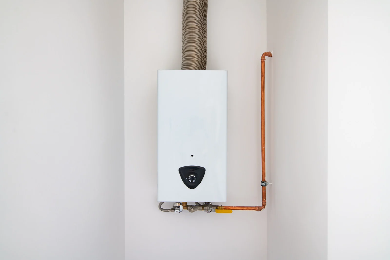 Guru Service Group expert repairing malfunctioning tankless water heater